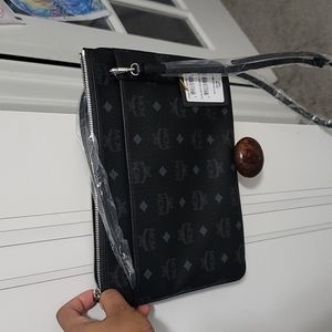 MCM crossbody/clutch.Brand new. Only taken out of the dustbag for pictures.